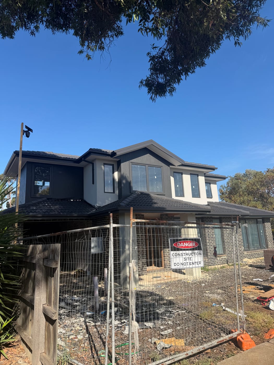 Completed Melbourne home with a new charcoal tile roof