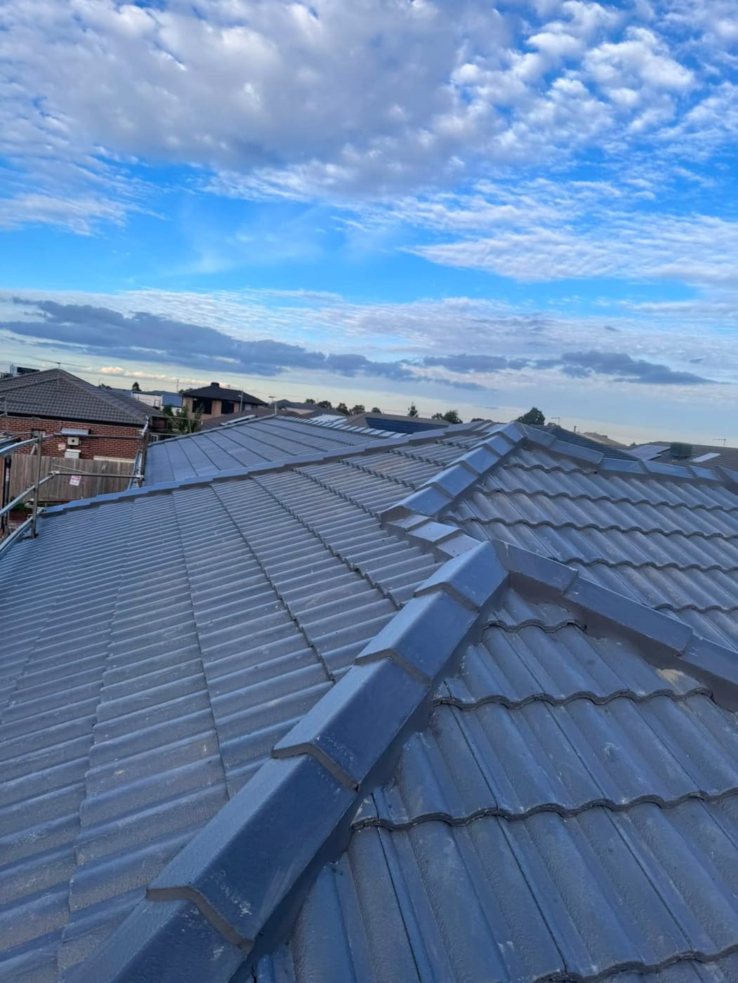 Charcoal roof tiles and ridge capping, close up